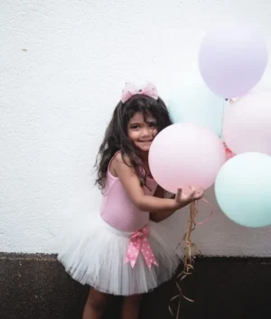 The ANNIKA tutu | Ages: 0-3 | White tulle with a light pink polka dotted bow.